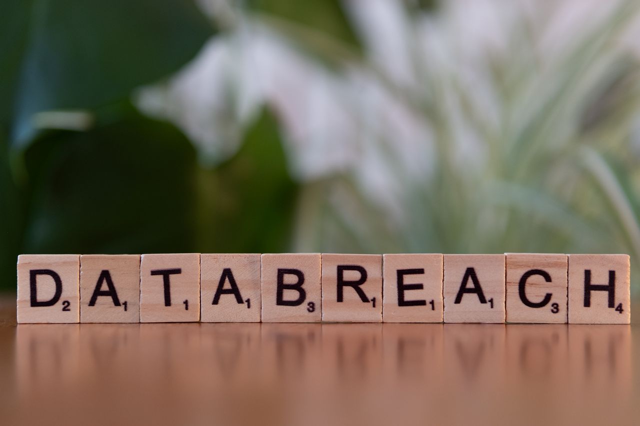 Home Close-up of Scrabble tiles spelling 'data breach' on a blurred background
